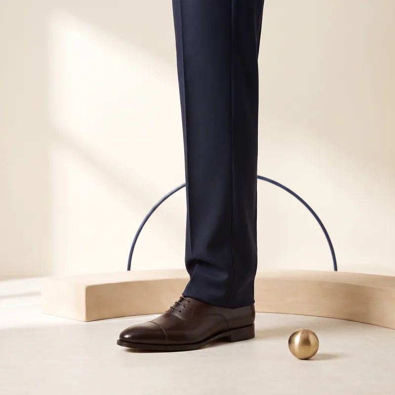 Full Break trouser hem meeting the shoe