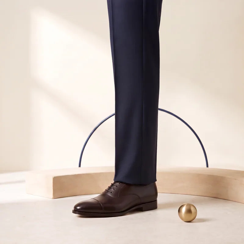Half Break trouser hem meeting the shoe