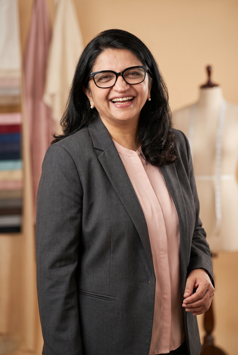 Bindu Thakkar in a charcoal blazer in the Lines & Lapel studio