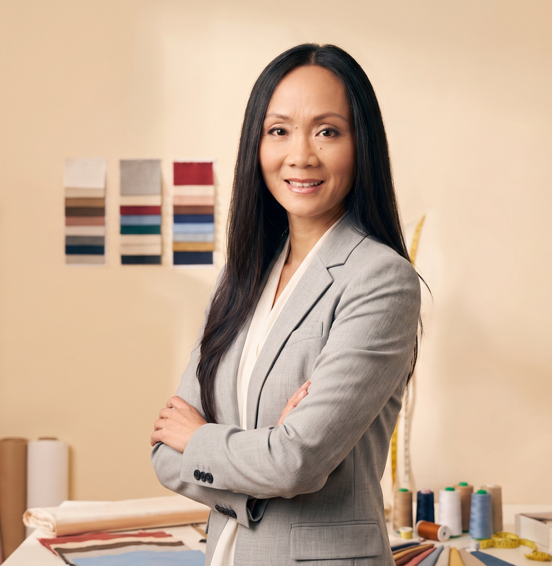 Rosa Lan Jarman in a light grey blazer in the atelier