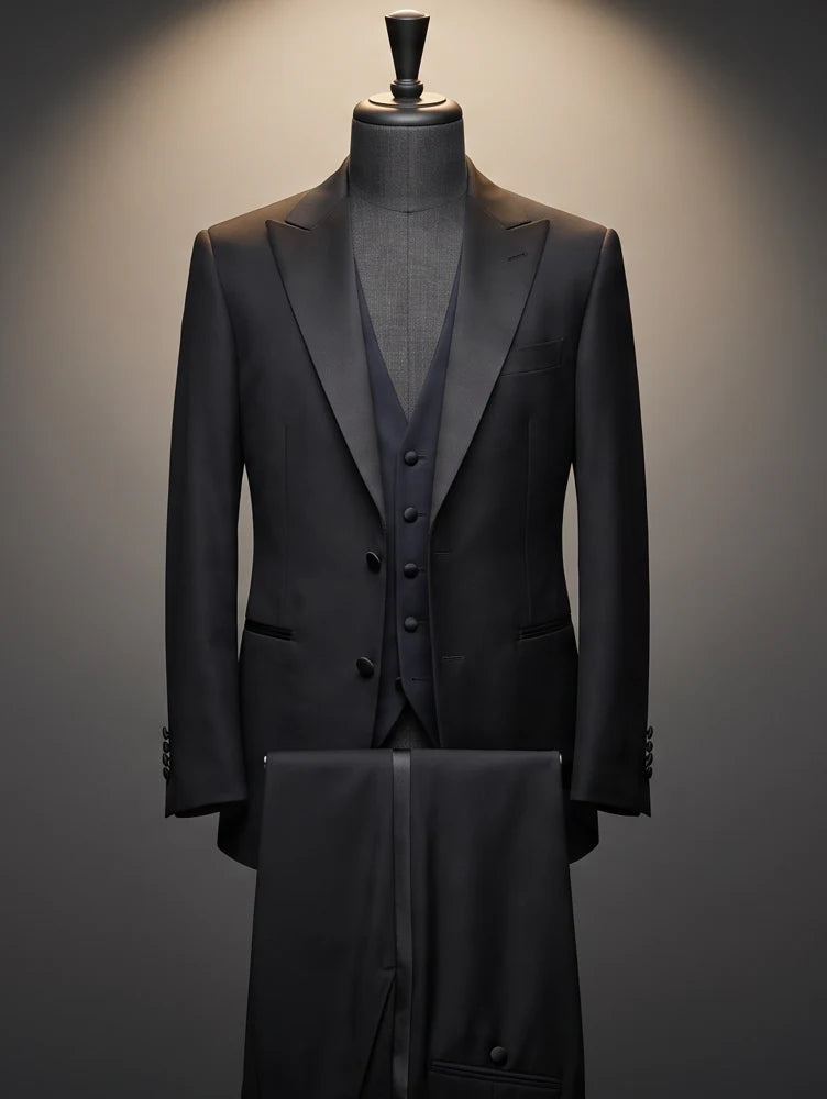 Black tuxedo with waistcoat and trousers on a tailor’s dress form